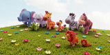 Toy animals including an elephant, sheep, giraffe, and others on a grassy field with flowers.